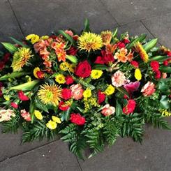 Funeral Flowers - Casket spray in radiant colours