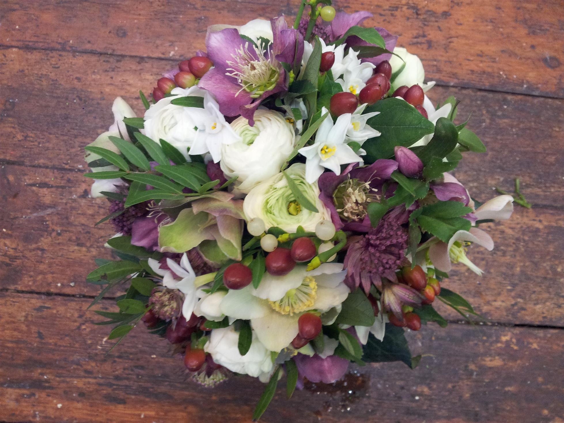 Well I finally got the bouquet completed and off to the Venue along with the natural table pots.  I complemented the Hellebores with a mixture of other blooms, foliage and berries to give a real country feel to the bouquet and create the effect that they wanted for their wedding.  It was really tight on time as the final delivery of cut stems only came in at 8am for the wedding at 10.30am but got it all done and delivered ontime……….Phew! 